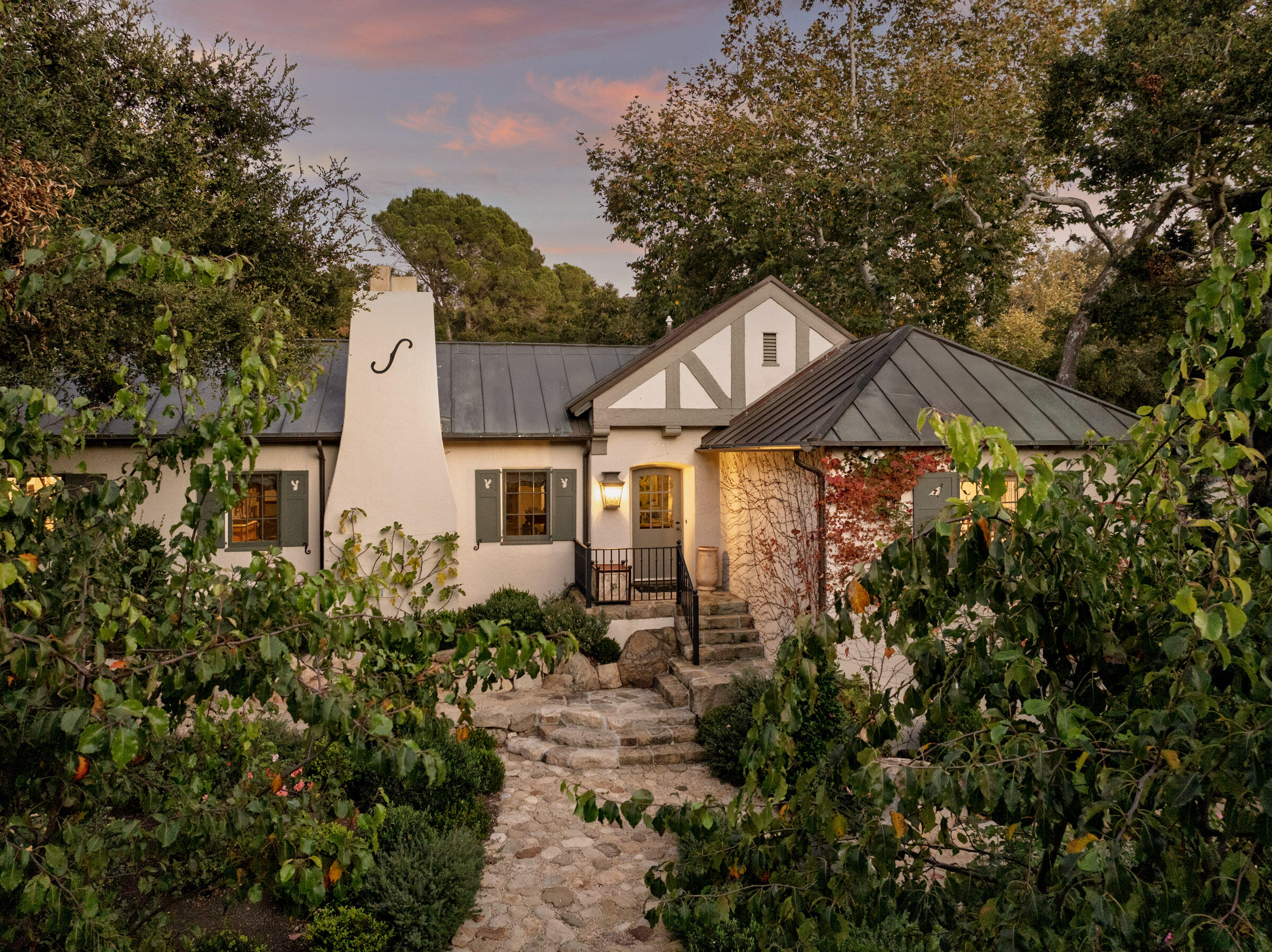 700 Mission Canyon Road Santa Barbara, CA 93105 - Photo 39 of 44 a front view of a house with a yard and fountain in middle