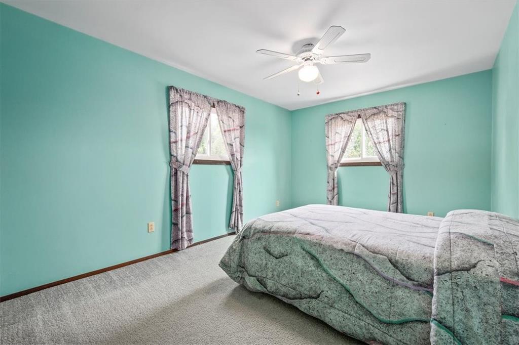 756 Charles Street Rochester, PA 15074 - Photo 14 of 25 a bedroom with a bed and a window