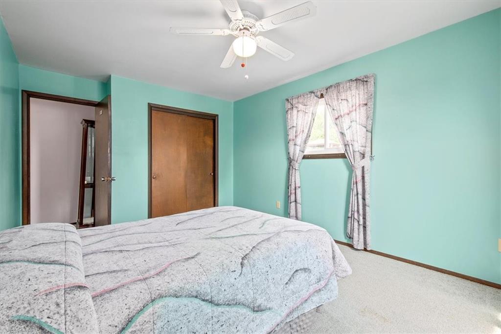 756 Charles Street Rochester, PA 15074 - Photo 15 of 25 a bedroom with a bed and a chandelier