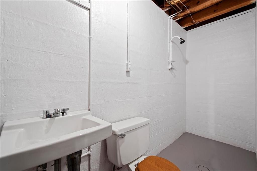 756 Charles Street Rochester, PA 15074 - Photo 20 of 25 a bathroom with a sink a toilet and shower