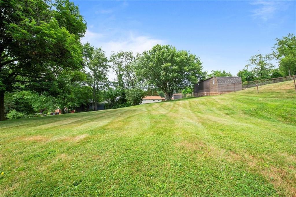756 Charles Street Rochester, PA 15074 - Photo 24 of 25 a view of a field with trees in the background