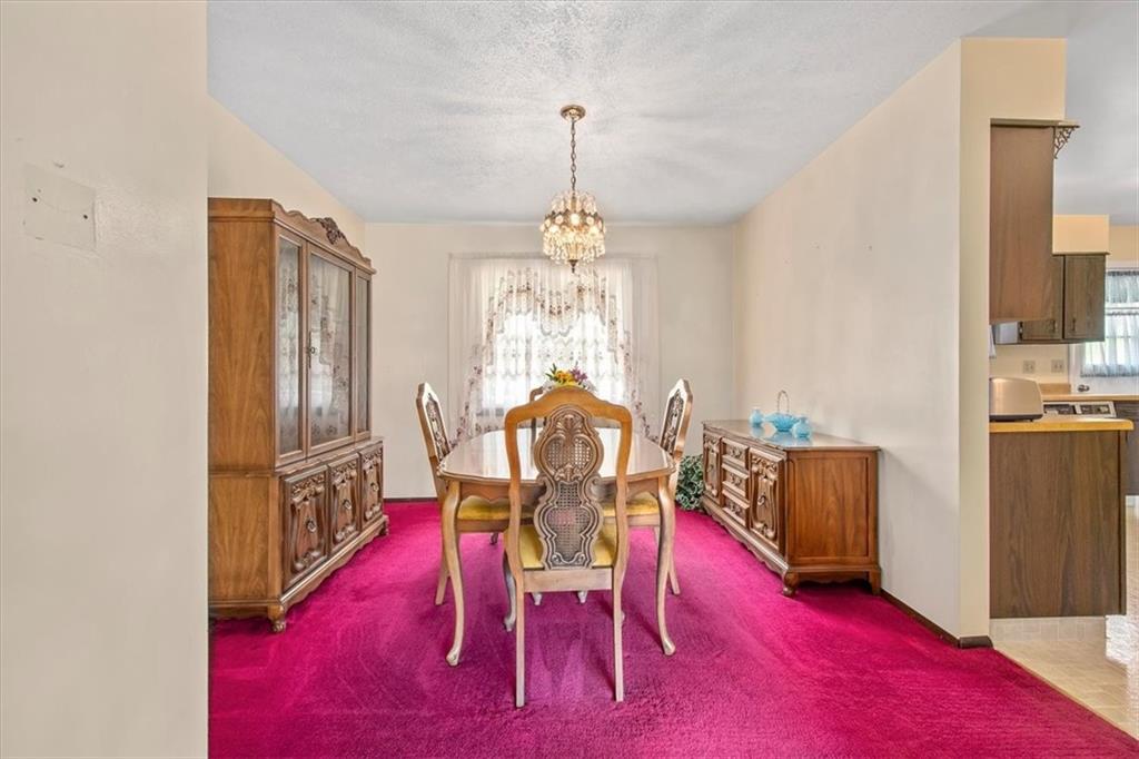 756 Charles Street Rochester, PA 15074 - Photo 7 of 25 a view of a dining room with furniture window and wooden floor