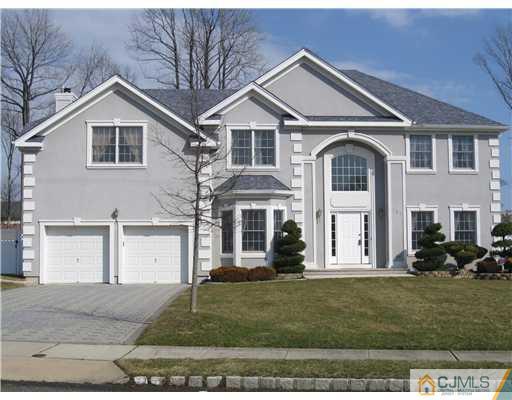 105 Autumn Road Old Bridge, NJ 07747 - Photo 1 of 16 a front view of a house with a yard