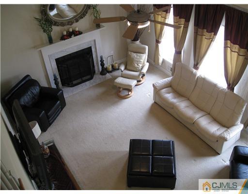 105 Autumn Road Old Bridge, NJ 07747 - Photo 2 of 16 a living room with furniture and a fireplace