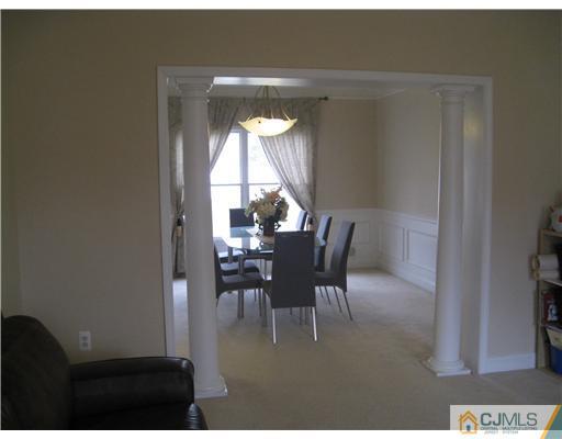 105 Autumn Road Old Bridge, NJ 07747 - Photo 6 of 16 a dining room with furniture and a potted plant