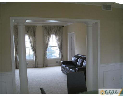 105 Autumn Road Old Bridge, NJ 07747 - Photo 7 of 16 a living room with furniture and a window