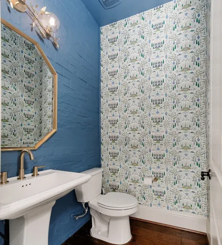 a bathroom with a toilet and a sink