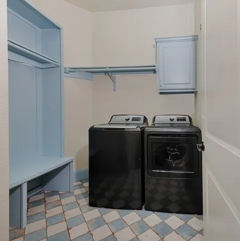 a view of a storage & utility room with washer and dryer