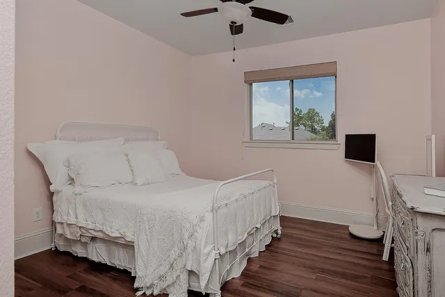 a bedroom with a bed and a desk