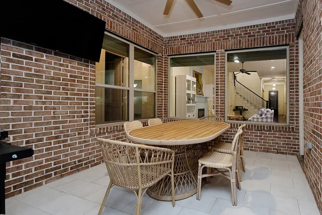 a patio with table and chairs