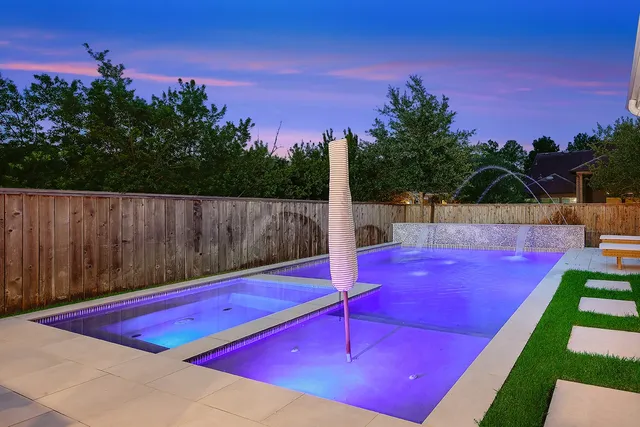 a view of a tennis court with sitting area