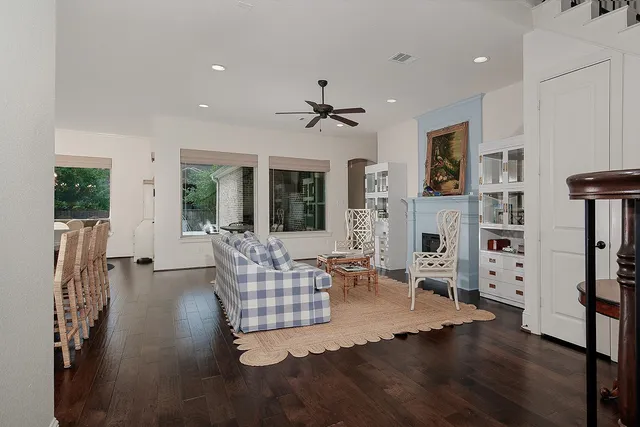 a living room with furniture fireplace and flat screen tv