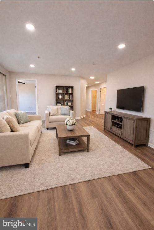 8801 Stoneridge Circle, Unit T2 Baltimore, MD 21208 - Photo 11 of 24 a living room with furniture and a flat screen tv