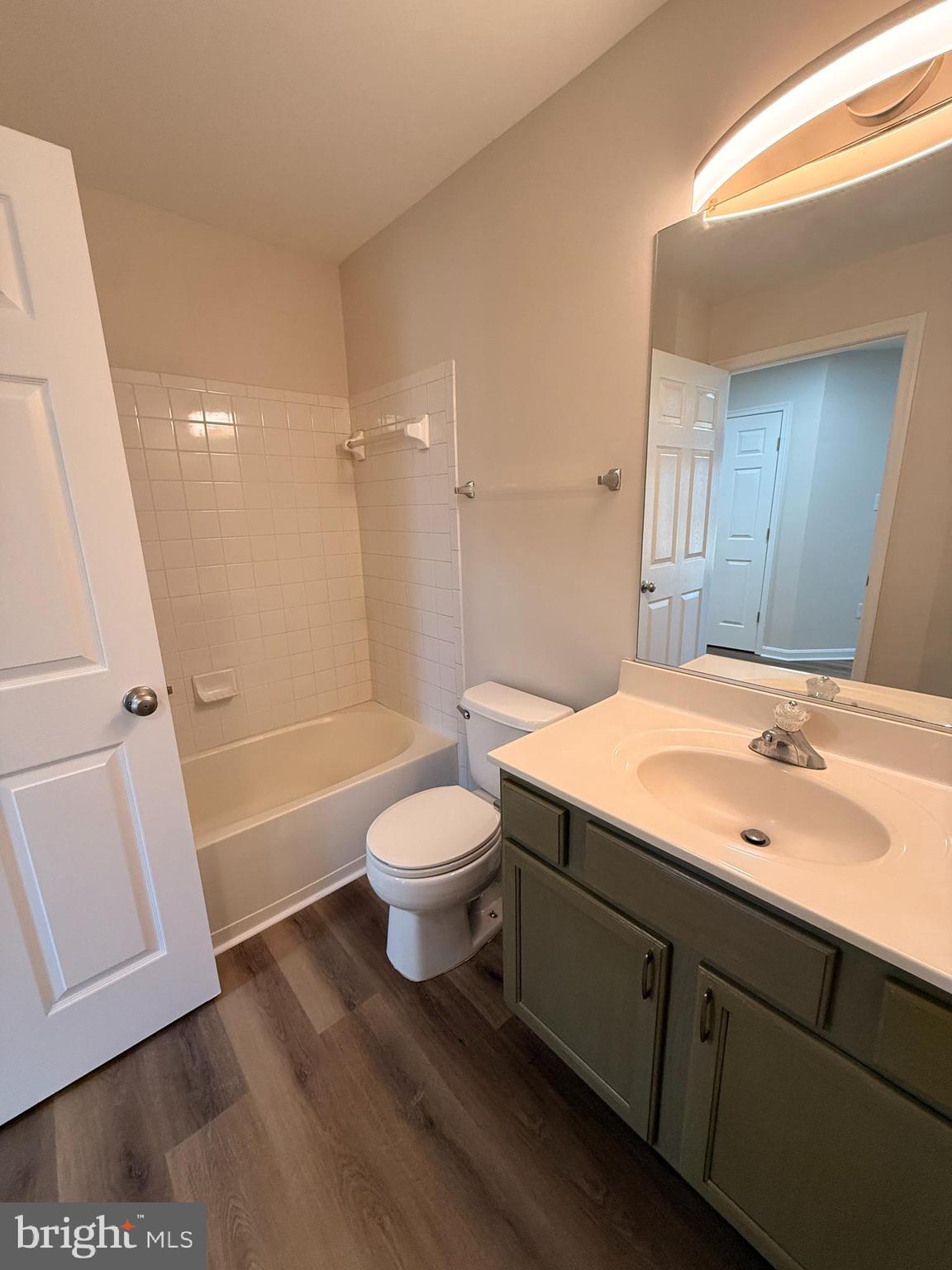 8801 Stoneridge Circle, Unit T2 Baltimore, MD 21208 - Photo 14 of 24 a bathroom with a sink a toilet and shower