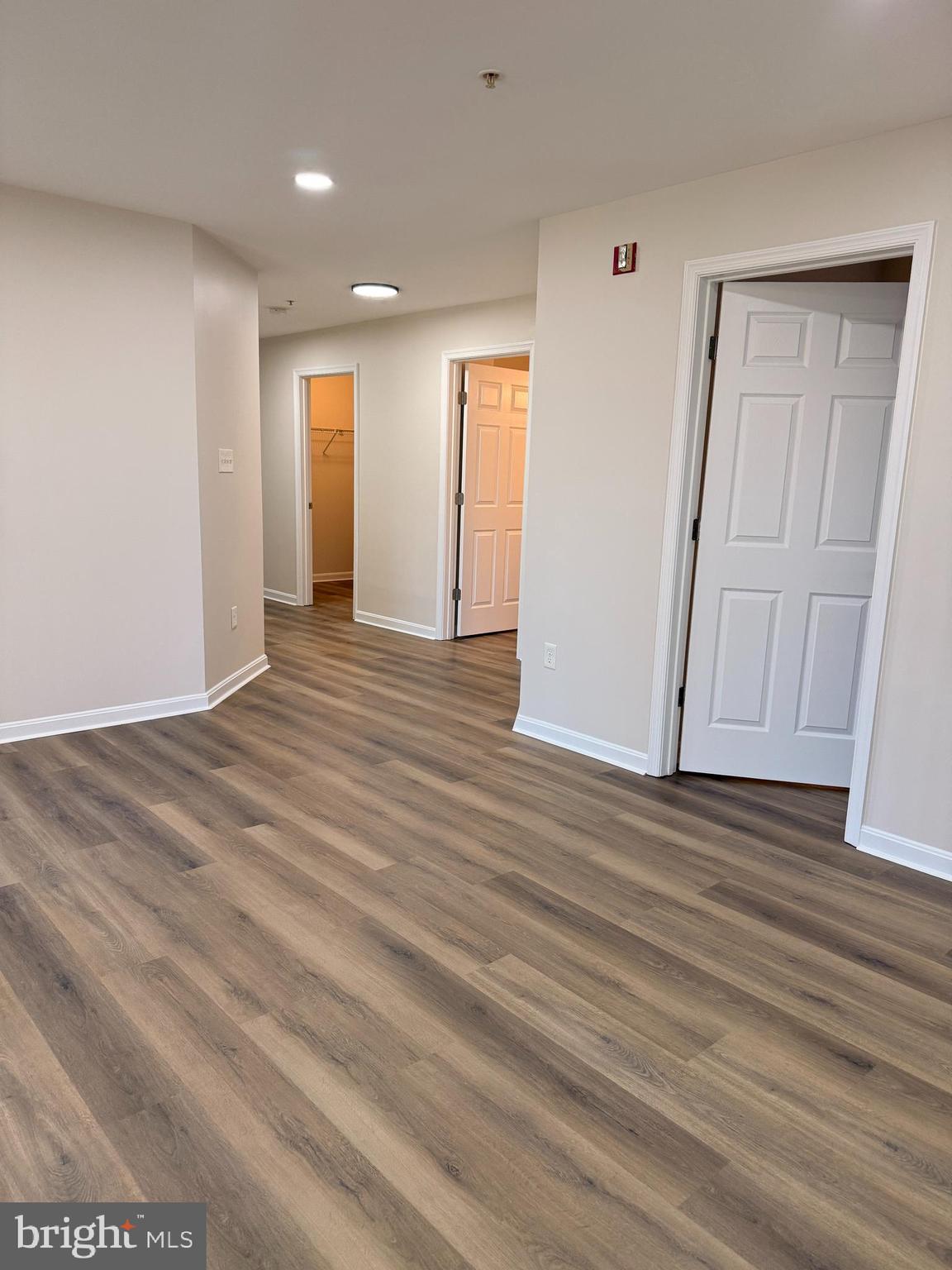 8801 Stoneridge Circle, Unit T2 Baltimore, MD 21208 - Photo 18 of 24 a view of an empty room with wooden floor