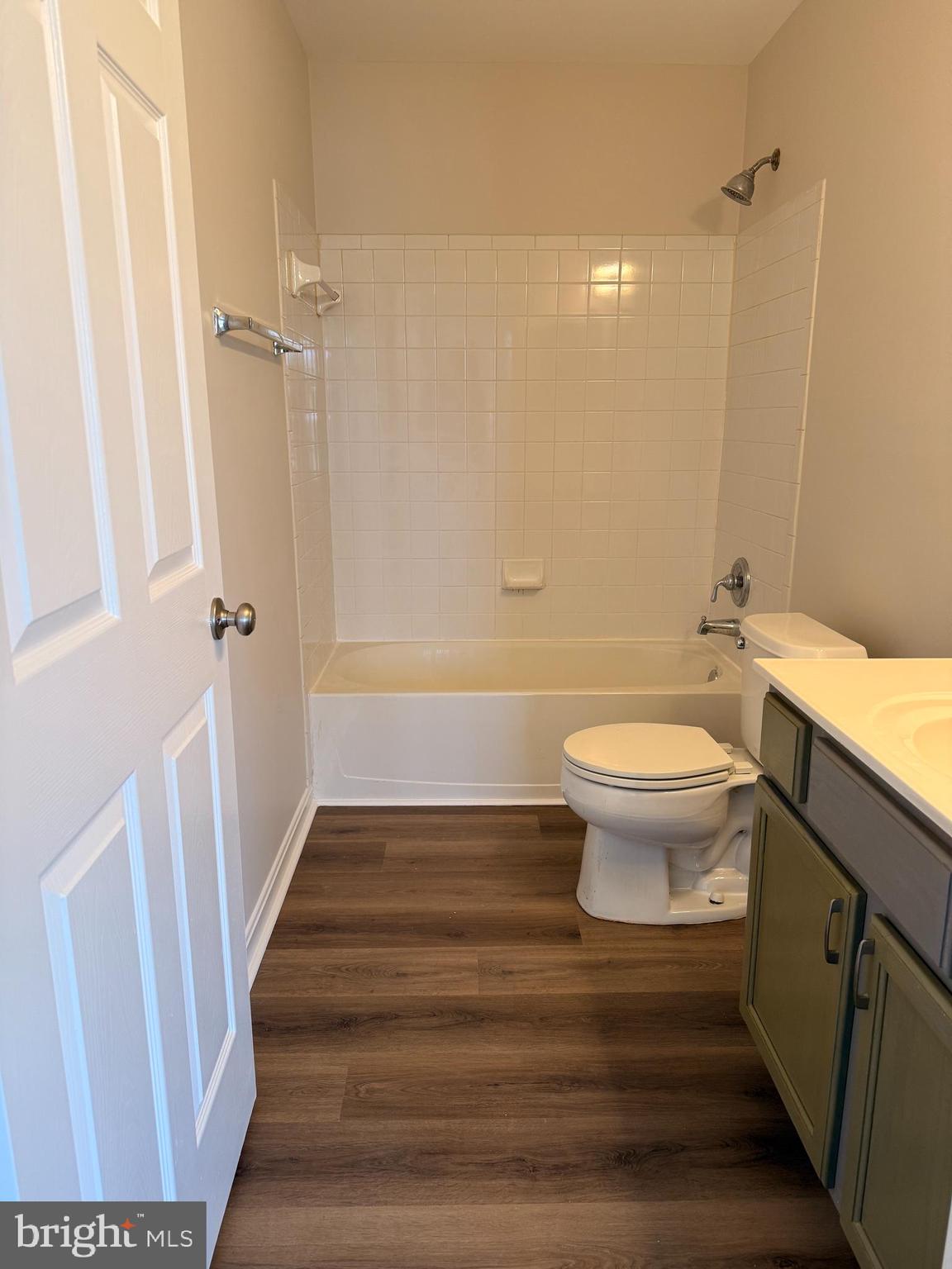 8801 Stoneridge Circle, Unit T2 Baltimore, MD 21208 - Photo 23 of 24 a bathroom with a sink toilet and shower