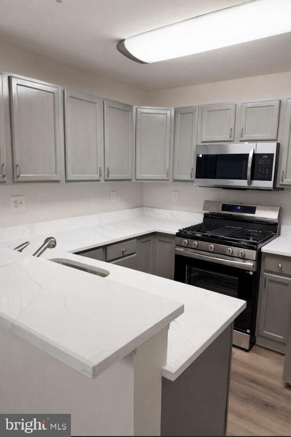 8801 Stoneridge Circle, Unit T2 Baltimore, MD 21208 - Photo 4 of 24 a kitchen with a appliances and a sink