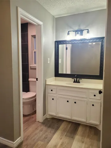 a bathroom with a sink double vanity and a mirror
