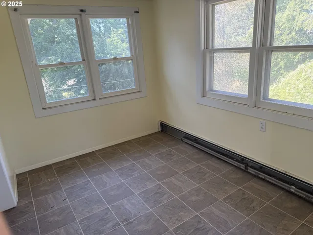 a view of a hallway with stairs