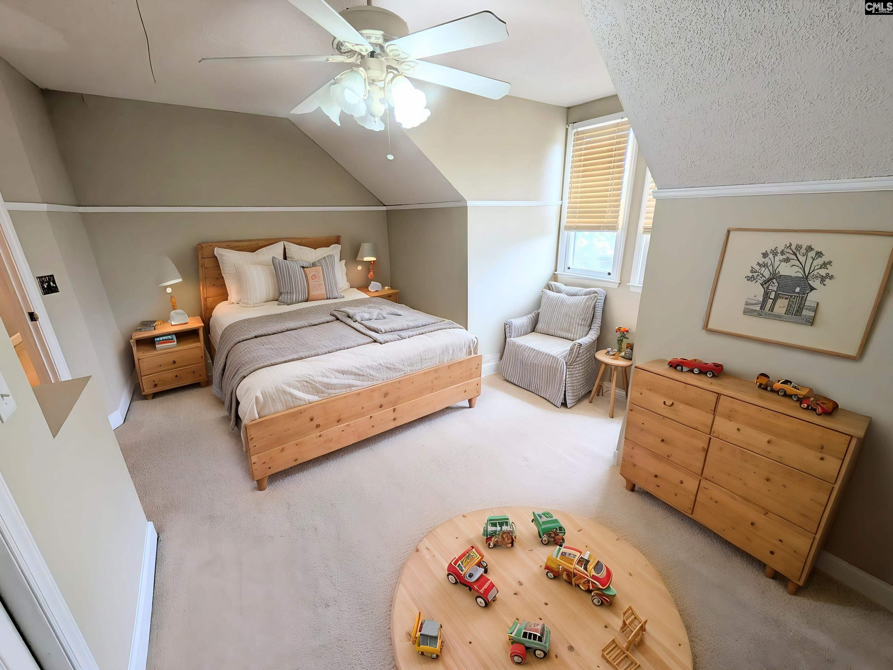 100 Welsh Court Lexington, SC 29073 - Photo 21 of 27 a spacious bedroom with a bed and a chandelier