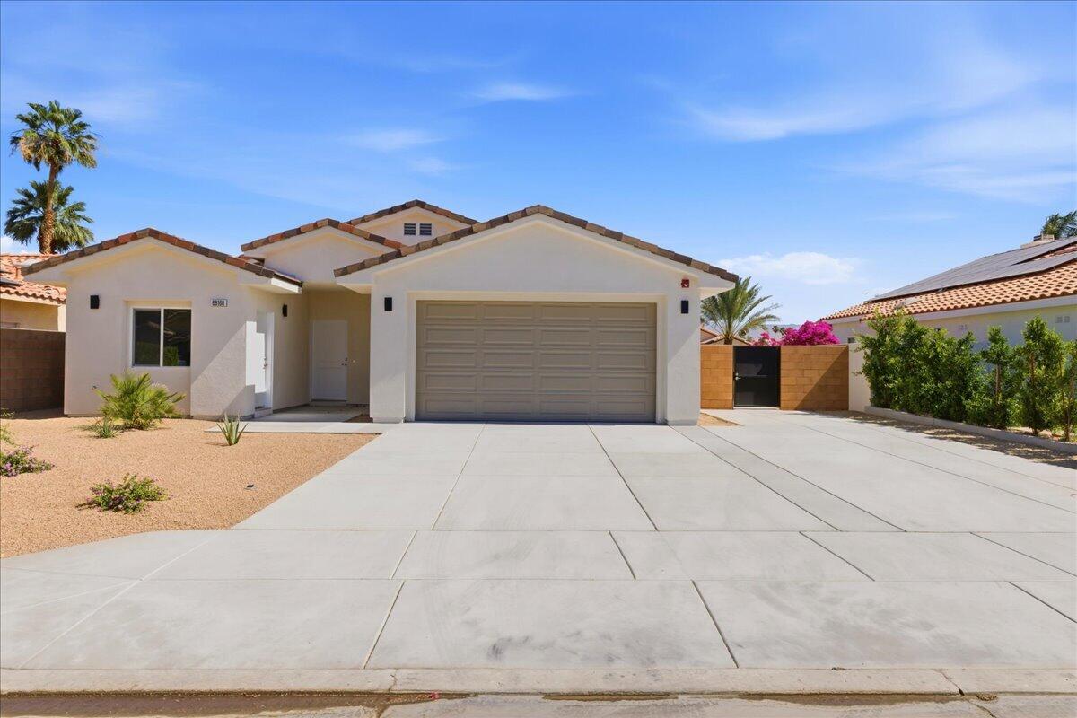 68160 Modalo Road Cathedral City, CA 92234 - Photo 4 of 57 a front view of a house with a yard