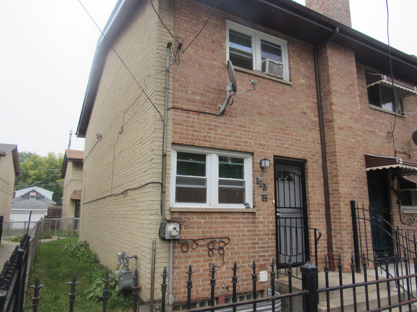 1132 East 81st Street, Unit H Chicago, IL 60619 - Photo 19 of 19 a view of a house with a window