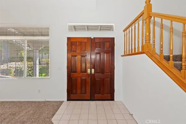 a view of an empty room with windows