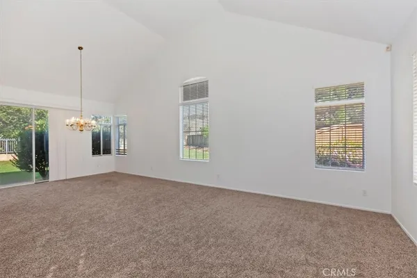a view of an empty room with stairs