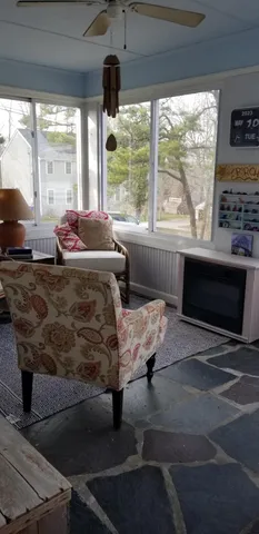 a bed sitting in a room next to a window