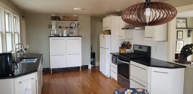 a view of a dining room with furniture and window