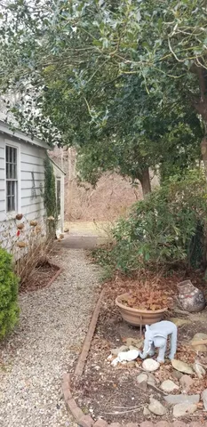 a backyard of a house with yard and outdoor seating