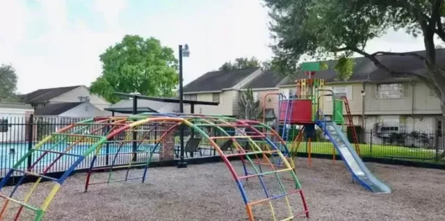 a view of yard with small play house and slide