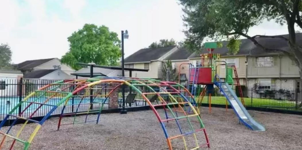 6432 Bankside Drive Houston, TX 77096 - Photo 14 of 14 a view of yard with small play house and slide