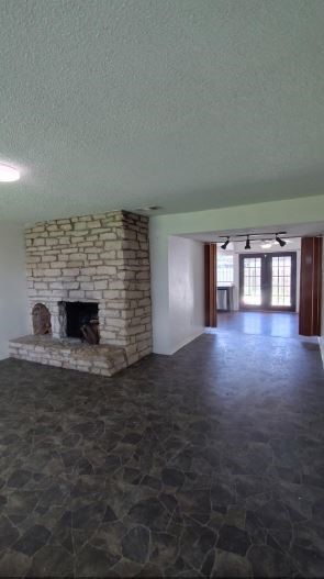 6432 Bankside Drive Houston, TX 77096 - Photo 3 of 14 a view of empty room with window and fireplace