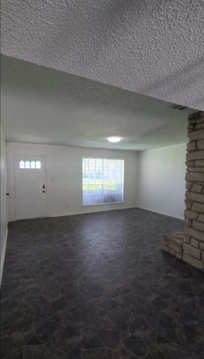 6432 Bankside Drive Houston, TX 77096 - Photo 4 of 14 an empty room with windows