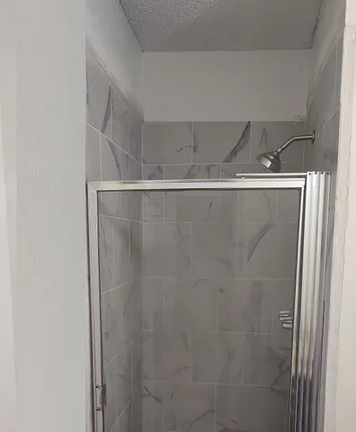 a view of a refrigerator in kitchen