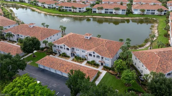 an aerial view of a house with a lake view