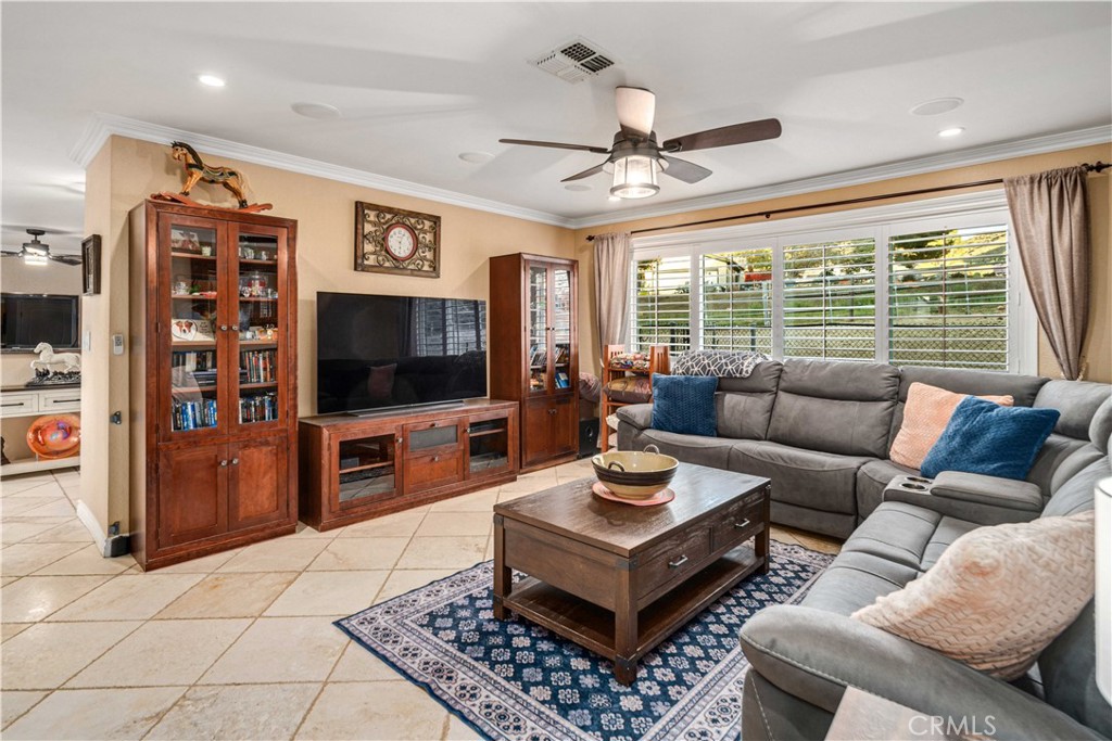 2862 Calmgarden Road Acton, CA 93510 - Photo 16 of 69 a living room with furniture a flat screen tv and a large window