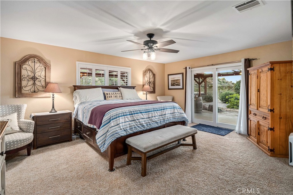 2862 Calmgarden Road Acton, CA 93510 - Photo 19 of 69 a bedroom with a bed couch and a window