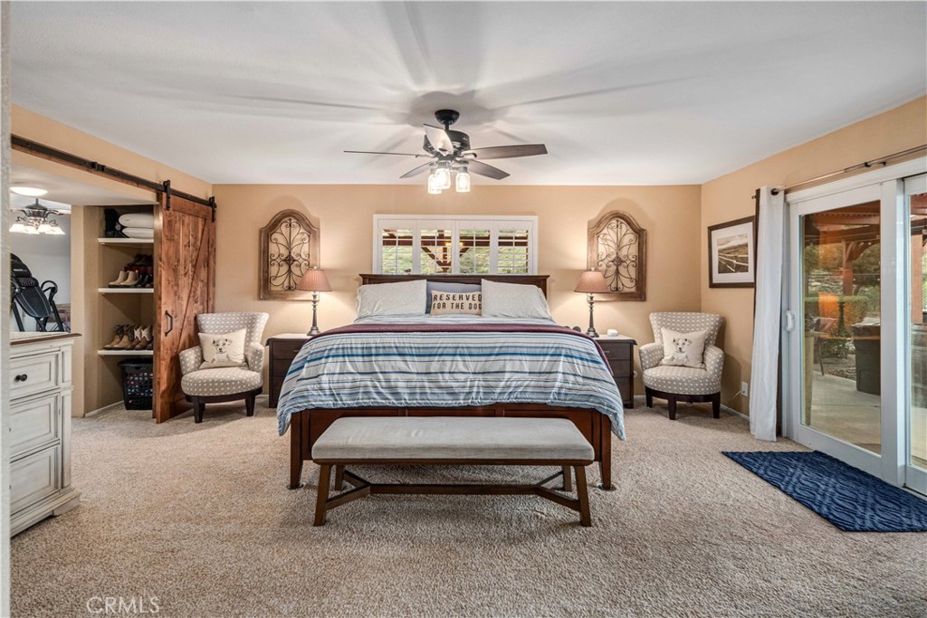 2862 Calmgarden Road Acton, CA 93510 - Photo 20 of 69 a bedroom with a bed and a chandelier