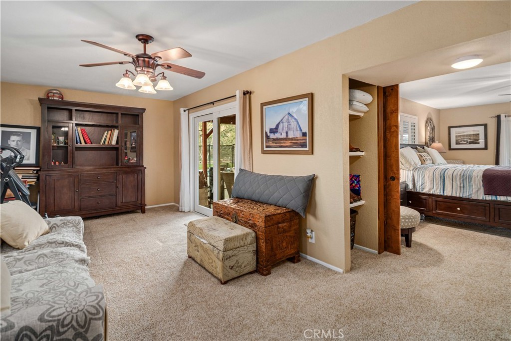 2862 Calmgarden Road Acton, CA 93510 - Photo 26 of 69 a spacious bedroom with a bed and a chandelier