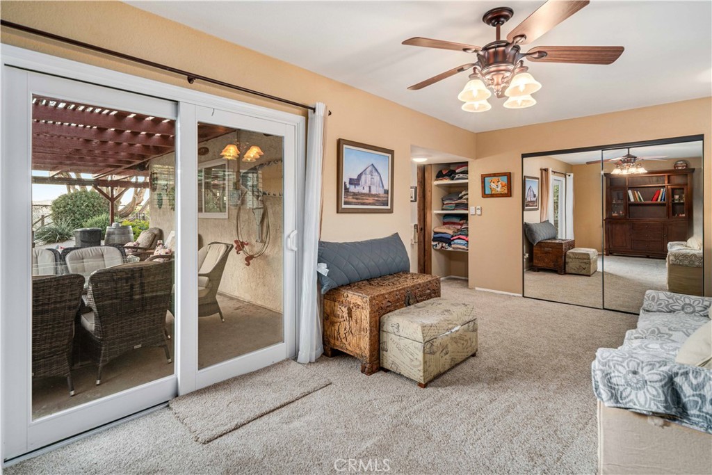 2862 Calmgarden Road Acton, CA 93510 - Photo 27 of 69 a living room with furniture and a floor to ceiling window