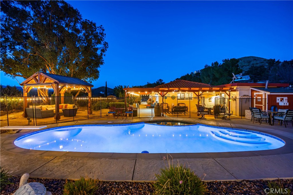 2862 Calmgarden Road Acton, CA 93510 - Photo 42 of 69 a view of an swimming pool with an outdoor seating