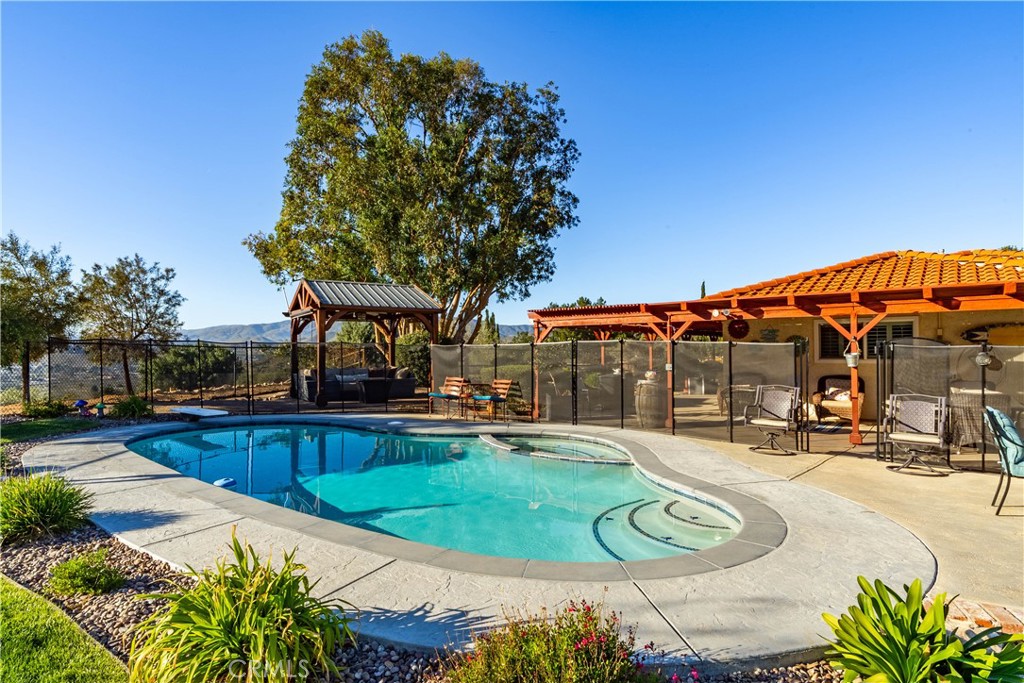 2862 Calmgarden Road Acton, CA 93510 - Photo 46 of 69 a view of a swimming pool with a patio