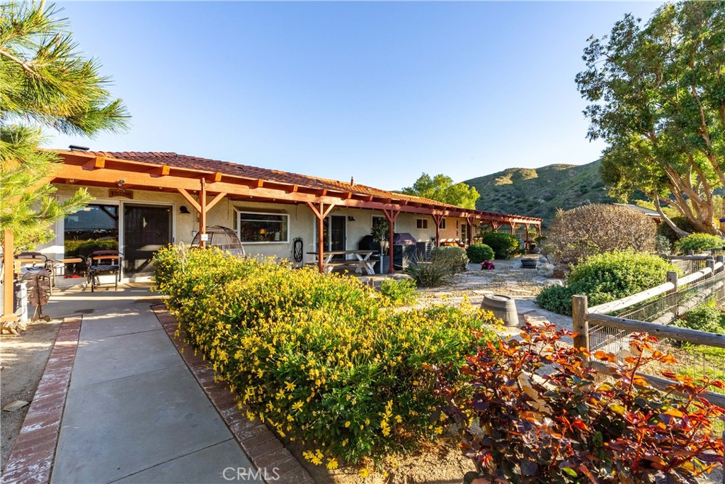 2862 Calmgarden Road Acton, CA 93510 - Photo 55 of 69 a front view of a house with a yard