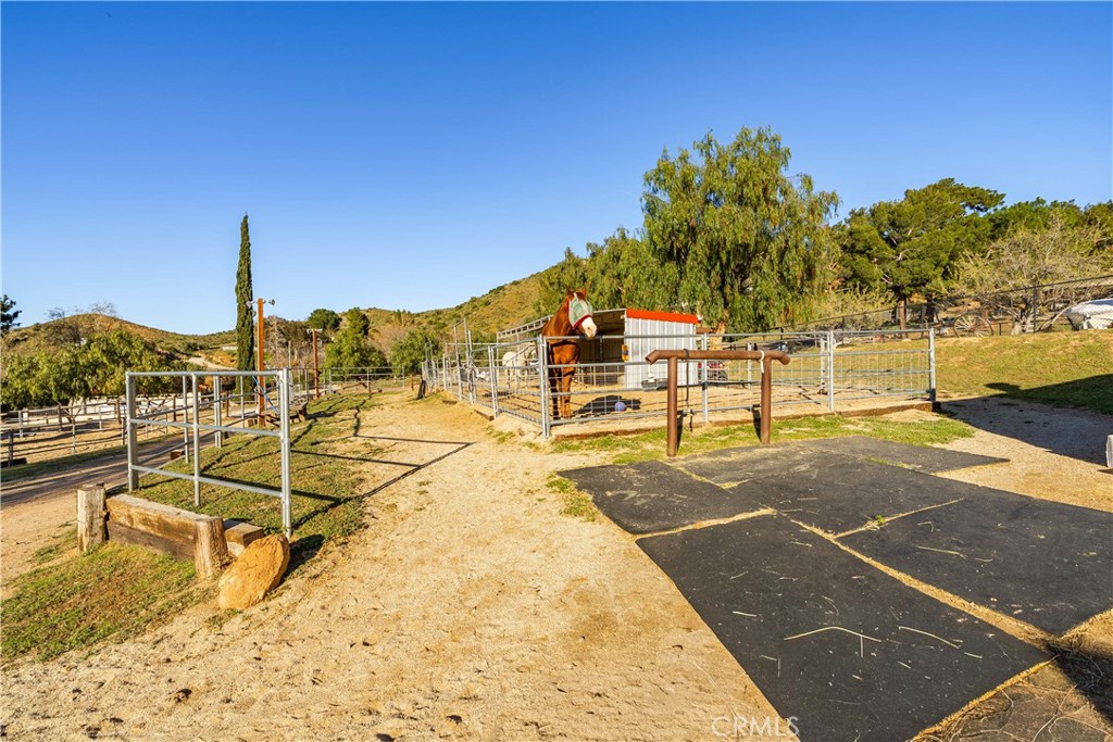 2862 Calmgarden Road Acton, CA 93510 - Photo 59 of 69 a view of a swimming pool with a bench and trees around