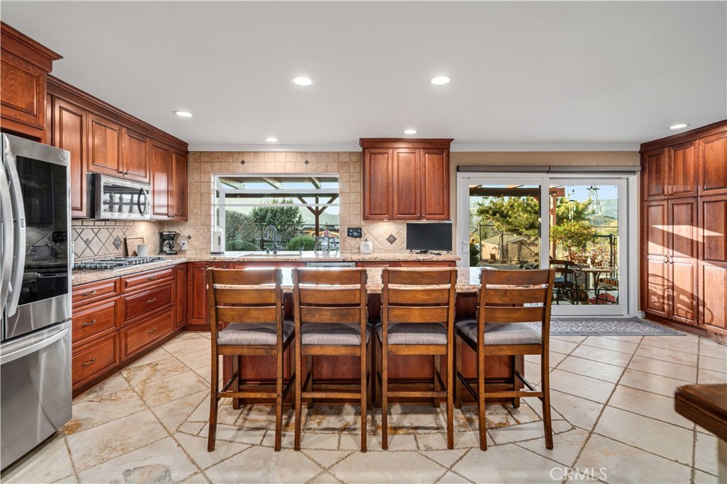 2862 Calmgarden Road Acton, CA 93510 - Photo 9 of 69 a large kitchen with a table and chairs