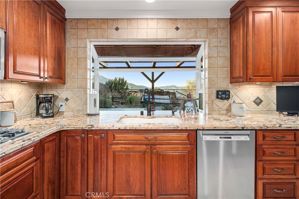 2862 Calmgarden Road Acton, CA 93510 - Photo 10 of 69 a kitchen with stainless steel appliances granite countertop a sink and cabinets