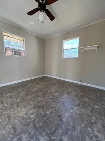 a view of an empty room with a window