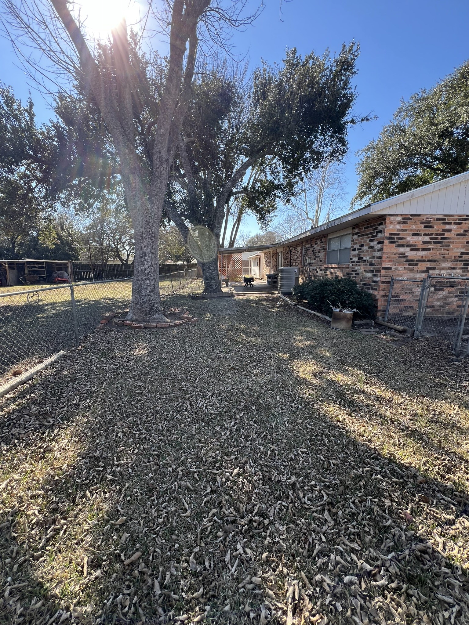 203 Franklin Road Wharton, TX 77488 - Photo 2 of 15 Fenced back yard with large covered paito
